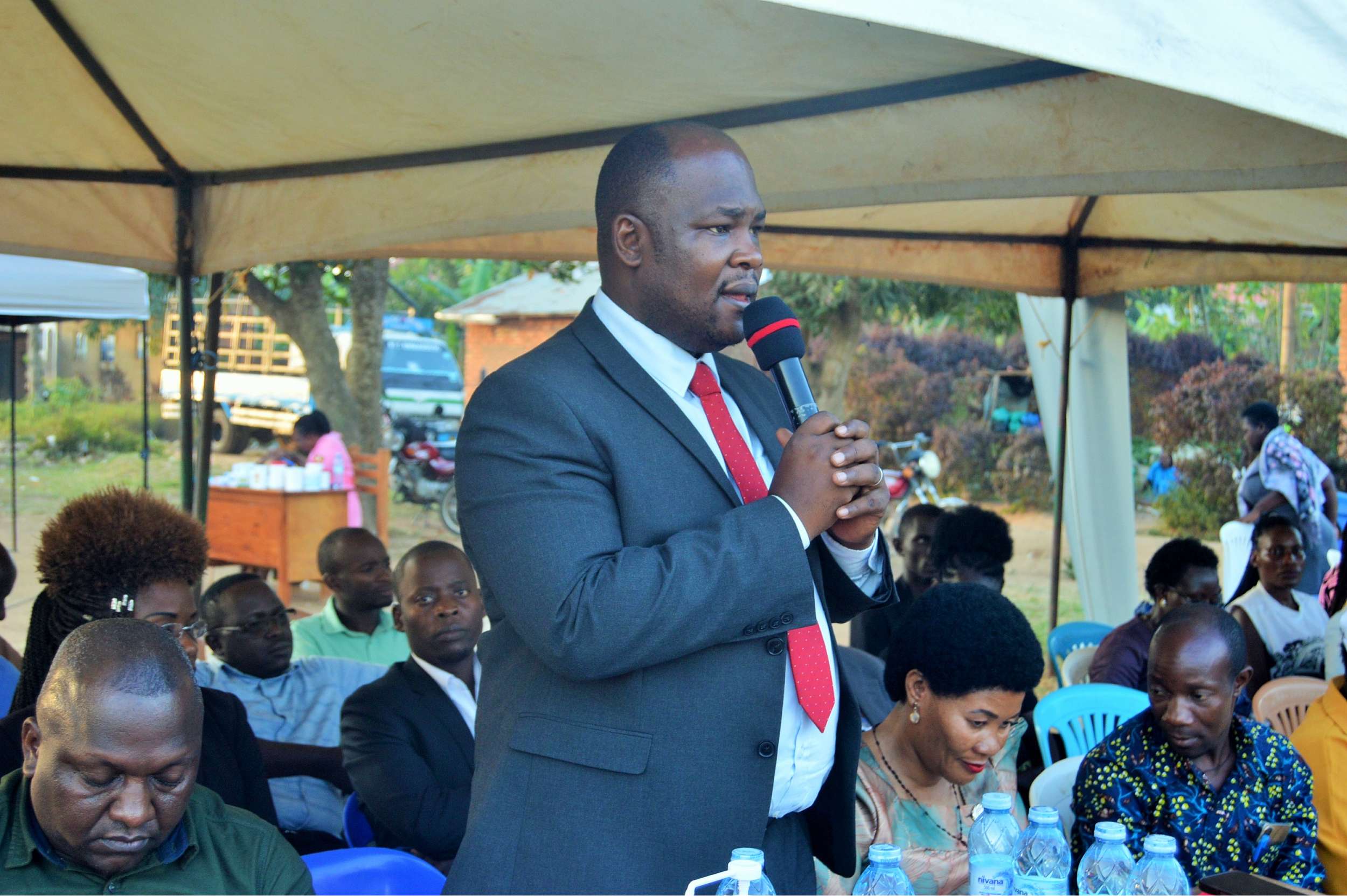 District Chairperson-Hon. Kawuki Peter addressing community during Community Baraza held at Nabyewanga in Nkozi Sub-County