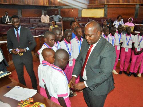District Chairperson-Hon Kawuki Simon Peter recognizes and celebrates excellence of Mpigi Pupils with Disabilities for winning the Trophy and Gold medals at the National Paralympic Games